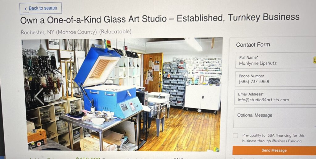 a computer screen with a picture of a glass art studio