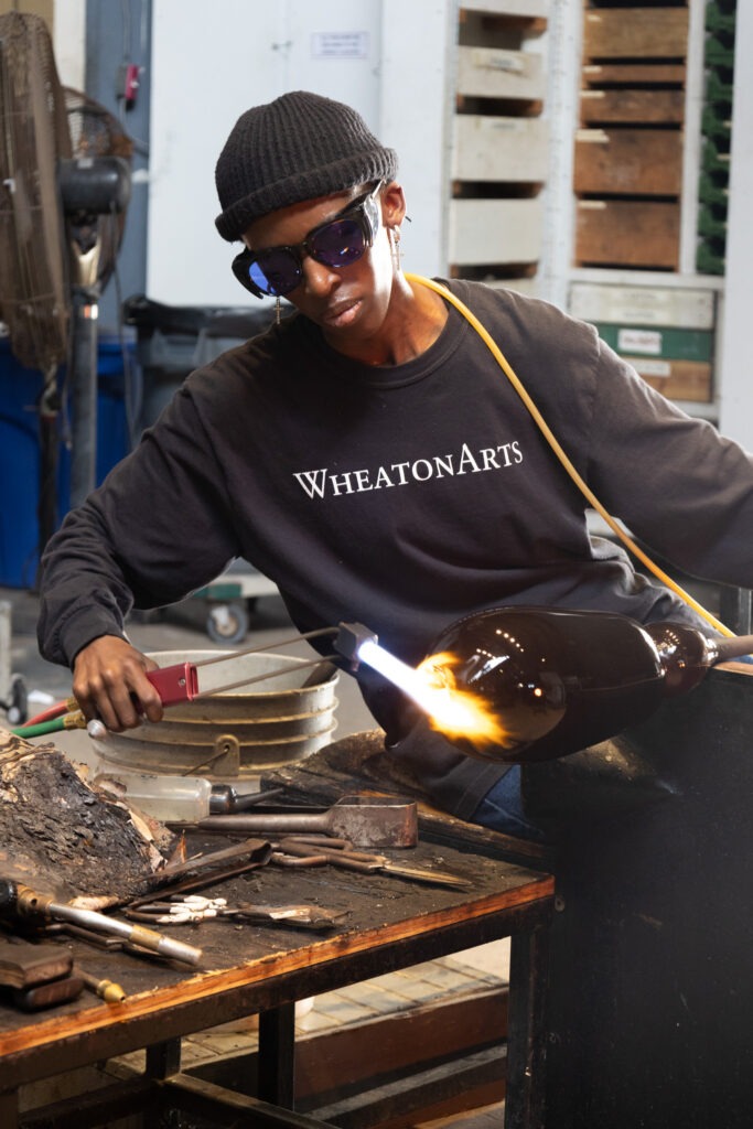 a person working in a glass studio