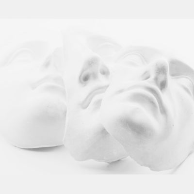 plaster sculpture of four faces